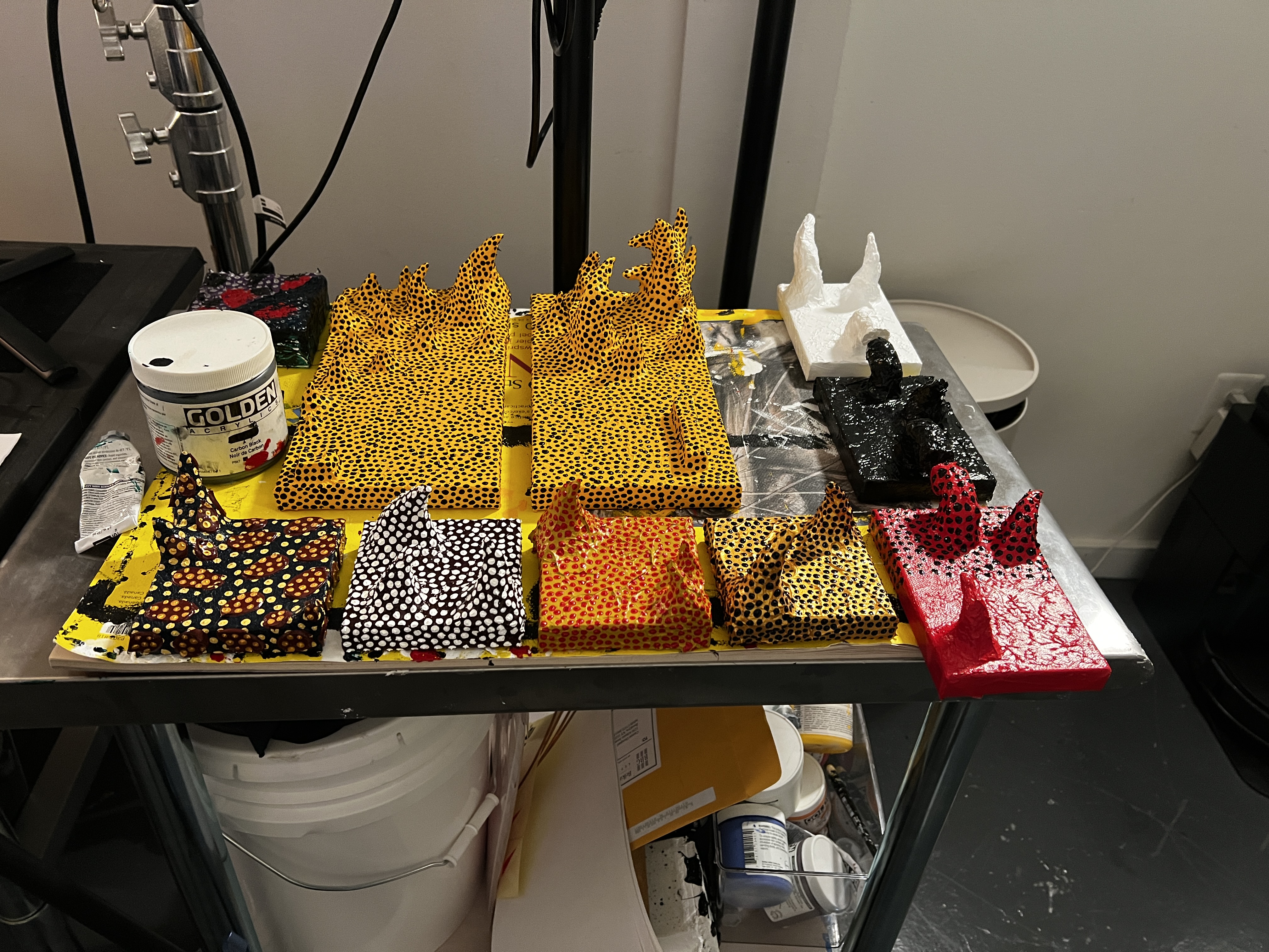 Henry Mattei’s studio workbench with painted, patterned and unpainted horned forms.